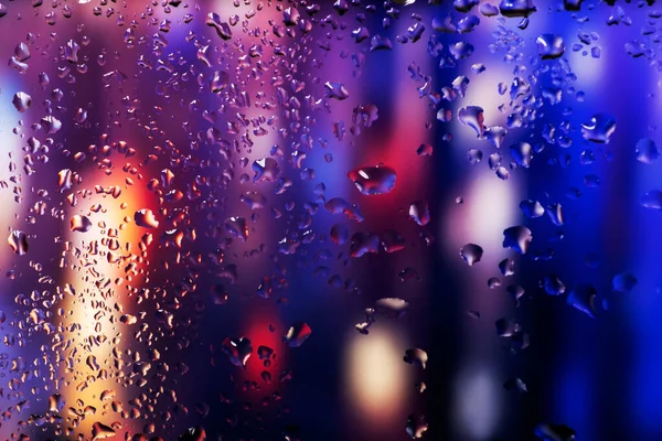 Condensation on the clear glass window. Water drops. Rain. Abstract background texture.