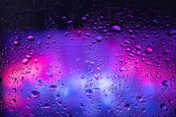 Rain Drops Condensation Window Glass Background Neon Light — Zdjęcie stockowe