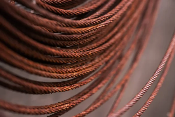 Round rusty steel wire coils. Metal reels for further industrial processing