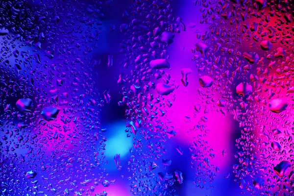 Rain Drops Condensation Window Glass Background Neon Light — Stock fotografie