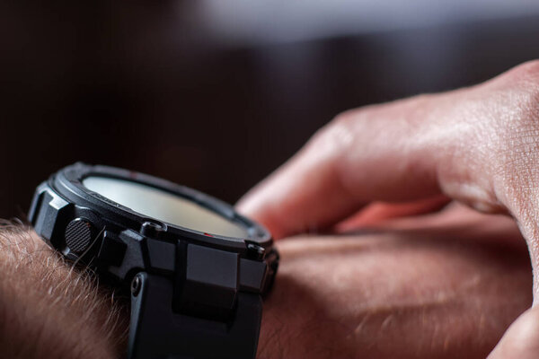 Man hand use smartwatch. Modern gadget that lets you always stay connected to internet