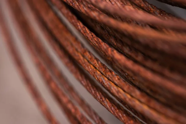 Round rusty steel wire coils. Metal reels for further industrial processing