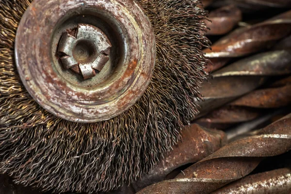 steel brush for drill clean off old metal sheet with rust.