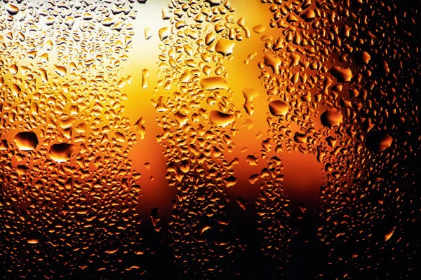 Condensation on the clear glass window. Water drops. Rain. Abstract background texture.