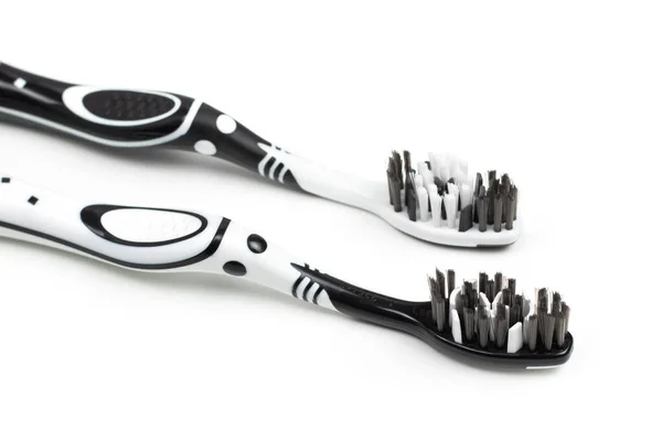 Two Toothbrushes Black White Color Dental Care Lies Table White — Stock Photo, Image