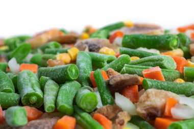 Dondurulmuş sebzeler. Havuç, Mısır ve bezelye dondurulmuş sebze karışımı