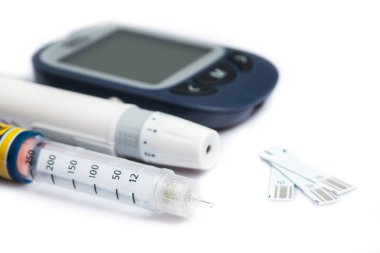 Measuring blood sugar. Glucometer with insulin pen on a white background. Isolate