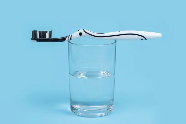 Black White Toothbrush Glass Mouthwash Blue Background Copy Space — Stock Photo, Image