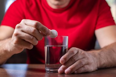 Man With Hangover Taking Medicine Pill Cure.