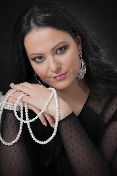 Woman with a pearl necklace — Stock Photo, Image