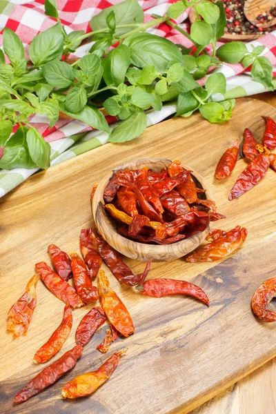 Chili peppers and herbs — Stock Photo, Image