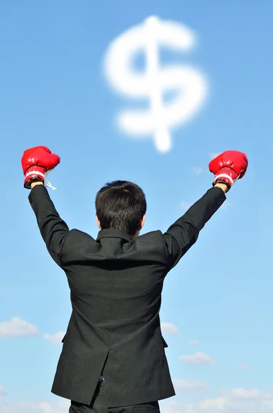 Businessman with boxing glove and dollar sign — Stock Photo, Image