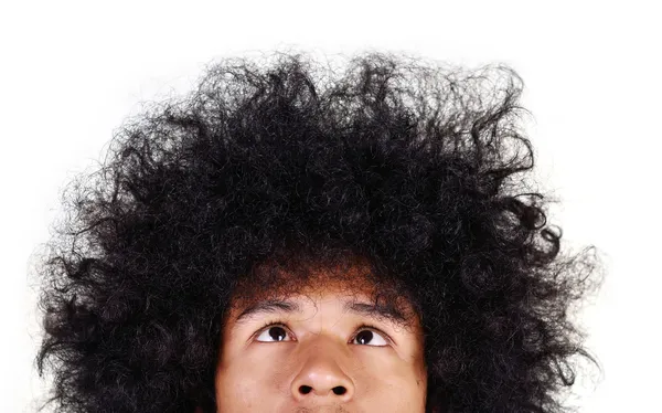 Yong man with long hair looking up — Stock Photo, Image