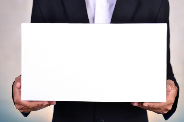 Business man holding white box — Stock Photo, Image