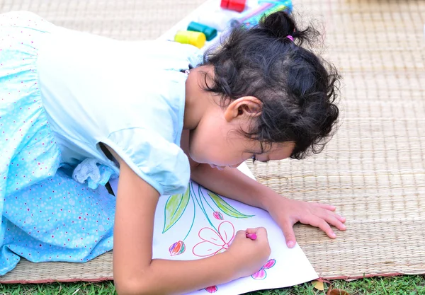 Going back to school,Girl drawing and painting over green grass — Stock Photo, Image