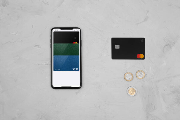 The concept of transferring money to the phone. Payment via smartphone. Phone with connected credit cards or psychic credit card, coins. Electronic money. Process of avoiding physical money