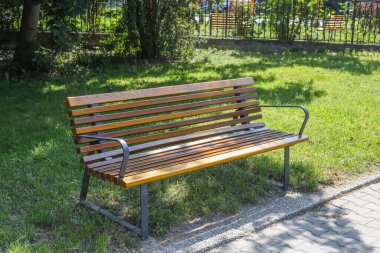 empty park bench in city