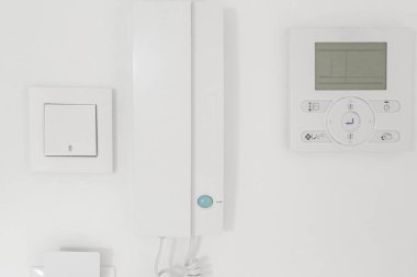 light switch, intercom handset, room air conditioning and full card light switch (card switch). Entrance to the room, apartment. Electronics in the house