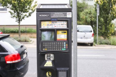 Warszaw, Poland - August, 2022: Parking machine with solar panel in the city street. Pay On Foot Parking System