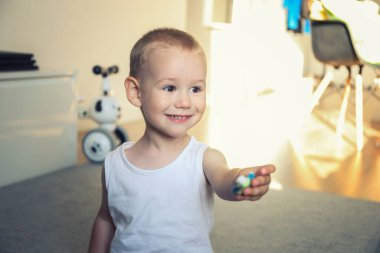 child and brushing teeth. Two years old, the child himself brushes his teeth with a toothbrush