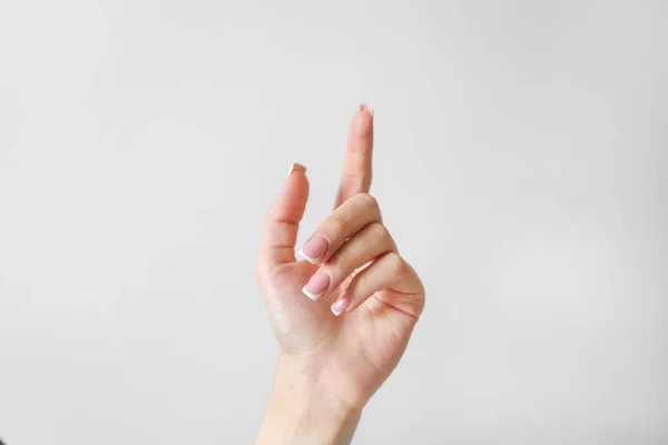 Mano Mujer Con Dedo Arriba Sobre Fondo Blanco —  Fotos de Stock