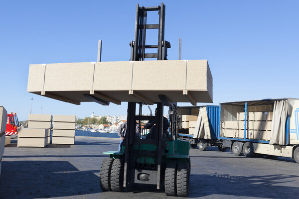 Green fork lifter truck and cargo box