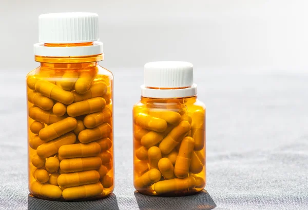 Two isolated bottles of medicine pills — Stock Photo, Image