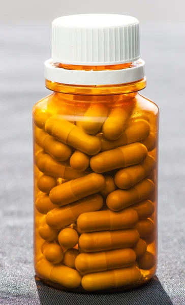 Isolated brown bottle of medicine pills — Stock Photo, Image