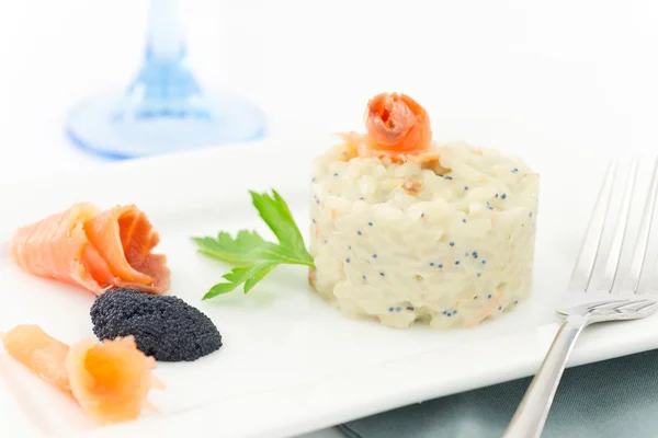 Rice with salmon and caviar — Stock Photo, Image