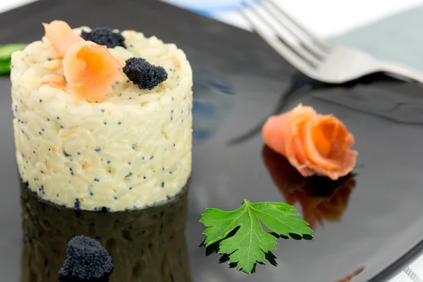 Rice with salmon and caviar — Stock Photo, Image