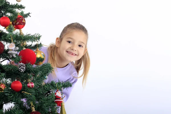 Little girl with Christmas tree — Stock Photo, Image