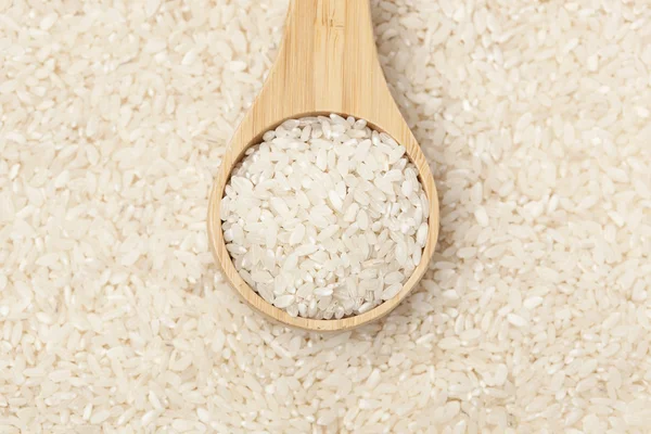 Healthy Dry Brown Rice in a spoon — Stock Photo, Image