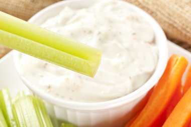 Organic Crunchy Celery and ranch dip clipart