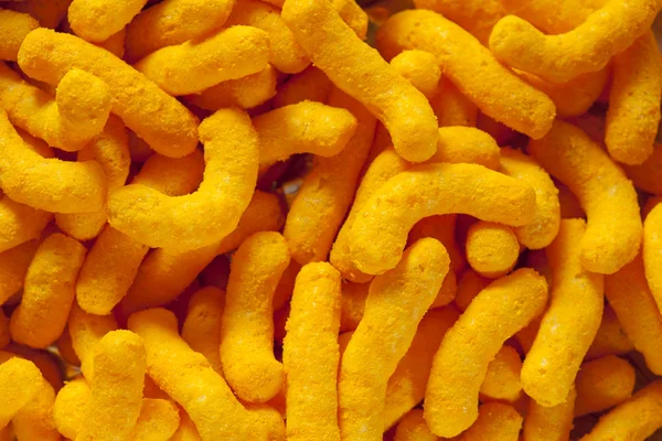 Crisps de queso hinchado naranja malsana — Foto de Stock