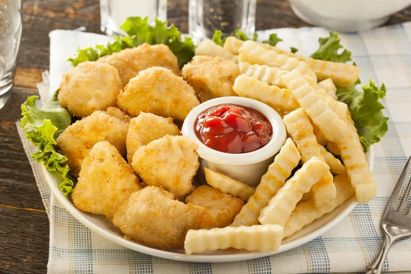 Unhealthy Chicken Nuggets and Fries — Stock Photo, Image