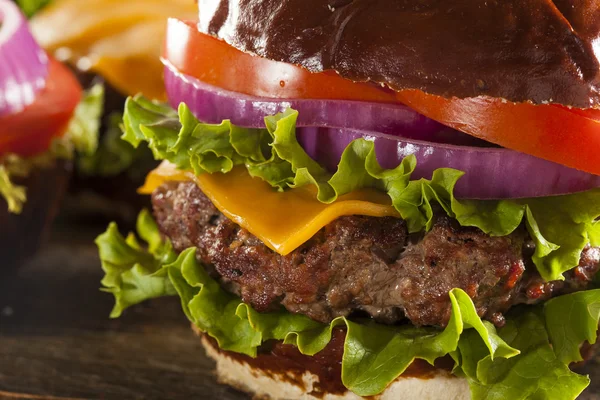 Gourmet Cheese Burger on a Pretzel Roll — Stock Photo, Image