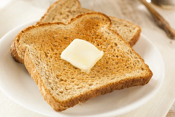 Fullkornsvete smörade toast — Stockfoto