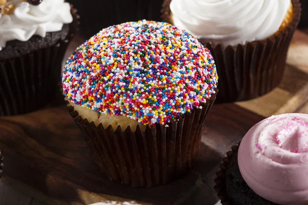 Assorted Fancy Gourmet Cupcakes with Frosting — Stock Photo, Image