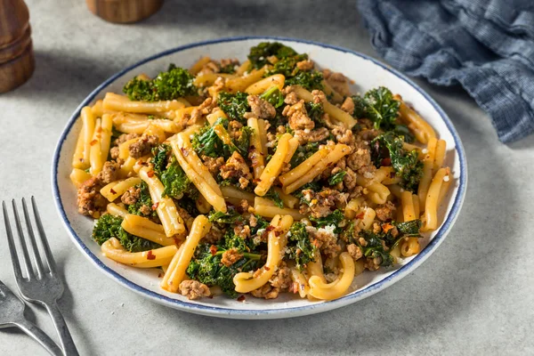 Homemade Kale and Sausage Caserecci Pasta with Cheese