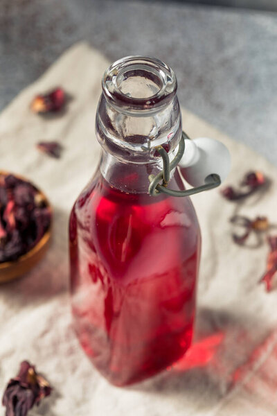 Homemade Sweet Hibiscus Tea Simple Syrup in a Bottle