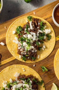 Homemade Mexican Shredded Beef Tacos with Onion and Cheese