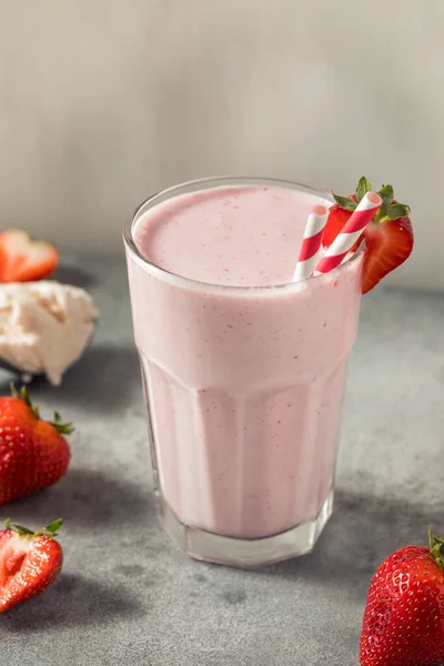 Cold Frozen Strawberry Milk Shake with a Straw