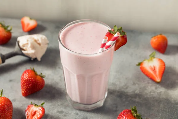 Cold Frozen Strawberry Milk Shake with a Straw