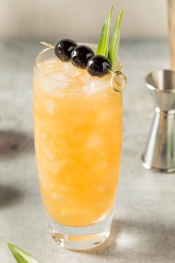 Cold Refreshing Three Dots and a Dash Cocktail with Rum and Pineapple