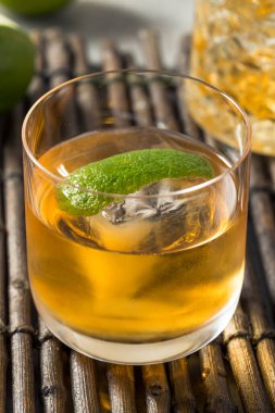 Boozy Cold Rum Old Fashioned with Lime and an Ice Cube