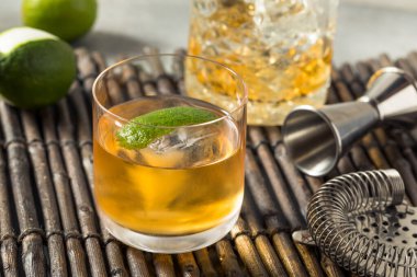 Boozy Cold Rum Old Fashioned with Lime and an Ice Cube