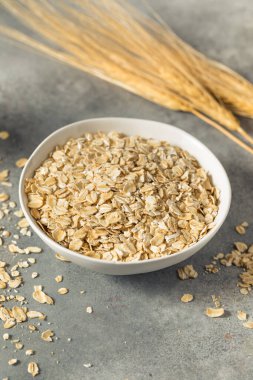 Dry Organic Rolled Oats Oatmeal in a Bowl