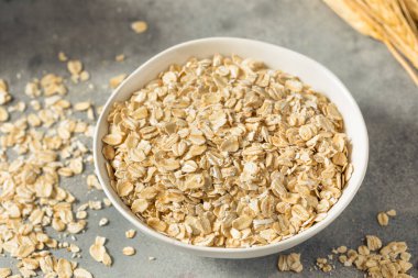 Dry Organic Rolled Oats Oatmeal in a Bowl