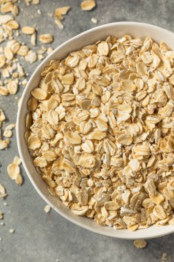 Dry Organic Rolled Oats Oatmeal in a Bowl
