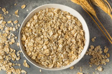Dry Organic Rolled Oats Oatmeal in a Bowl